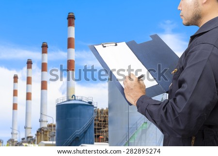 Engineer recording maintenance at modern thermal power plants