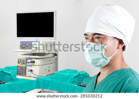 surgeon and equipment tools in operating room