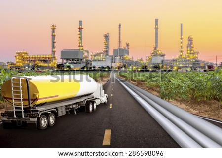 Tanker truck and oil pipeline for transport fuel on the highway to petrochemical oil refinery in sunrise