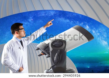 Astronomer pointing at milky way and space with telescope of observatory watching. elements of this image furnished by NASA.