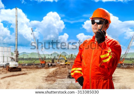 Engineer use radio communication for command working at construction site project