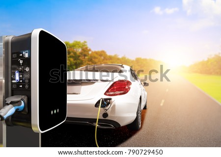 Charging an electric car on road with station for clean energy future of transportation ecology concept