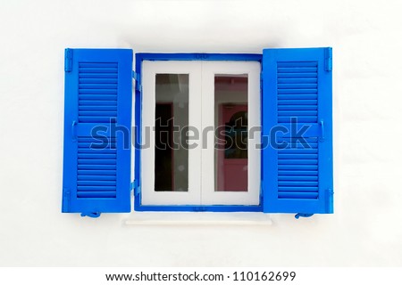 Blue window with white wall of official place.