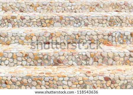 The way up stair are made from stone.