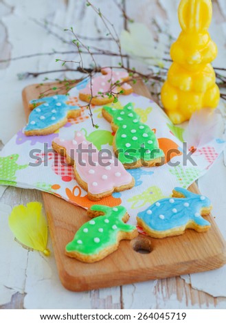 Easter homemade bunny orange cookie over white wooden table