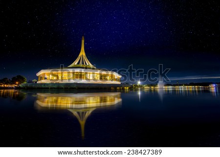 Monument at public park against water wave with nightlight and beautiful star in the sky at Suanluang Rama 9, Thailand