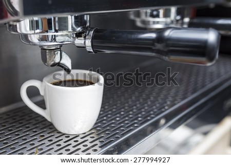 cup of coffee with professional coffee machine