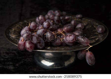 Purple Grapes still life vintage fruit bowl black velvet background