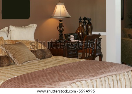 Bed and desk in master bedroom
