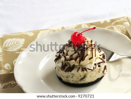 Chocolate cake with a maraschino cherry