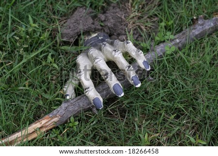 Skeleton hand coming out of grave