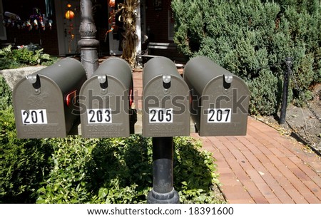 Four mail boxes with numbers