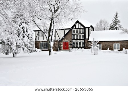 Winter scene of lodge with red door