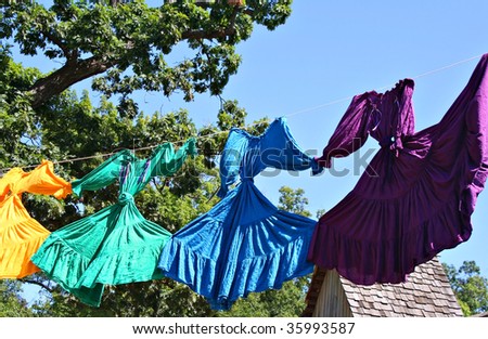 Bright color dresses on clothes line