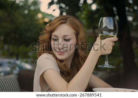 portrait of sexy young stylish smiling woman girl model in bright modern cloth who drinks wine