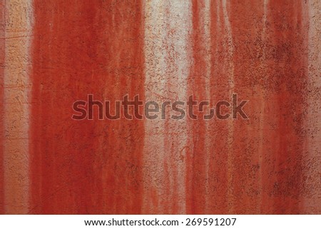 red metal background painted in red with scratches. texture and background