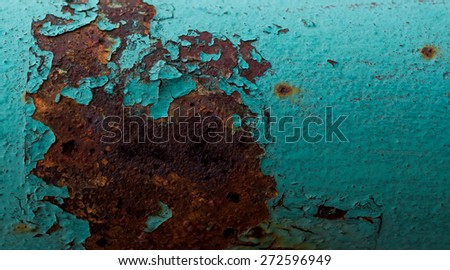 red rusted on the cyan green metal wall . background and Texture for your design.