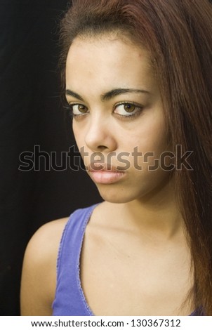 Portrait of an attractive black woman isolated on black background