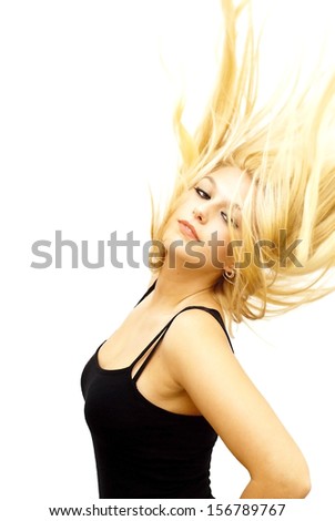Wonderful blonde woman with her hair in the wind on white background