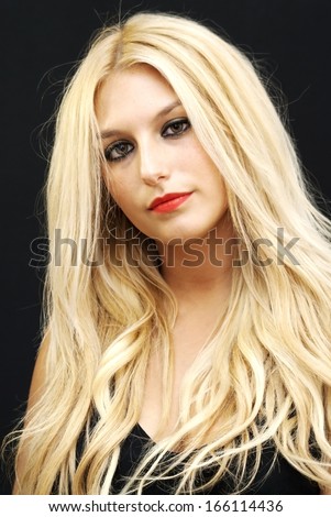 Wonderful blonde woman on black background