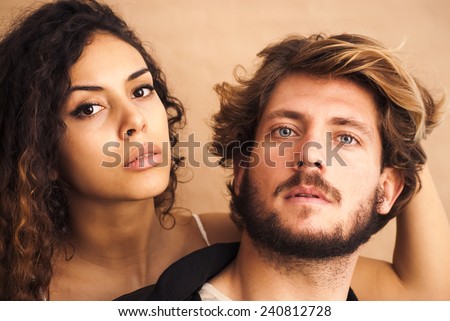 Beautiful portrait of a loving couple. She\'s pulling his hair.