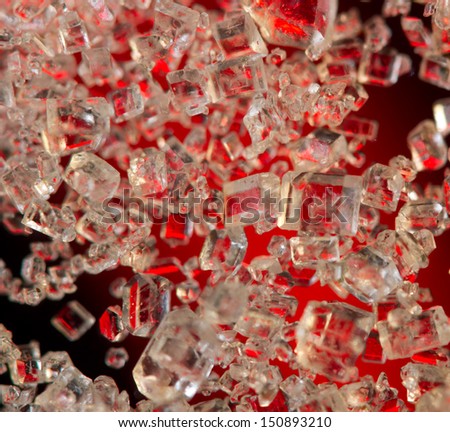 Crystals on a red background. Extreme closeup. Macro