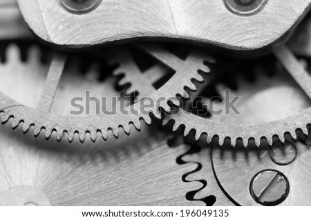 Black white background with metal cogwheels a clockwork Macro Black white background with metal cogwheels a clockwork Macro