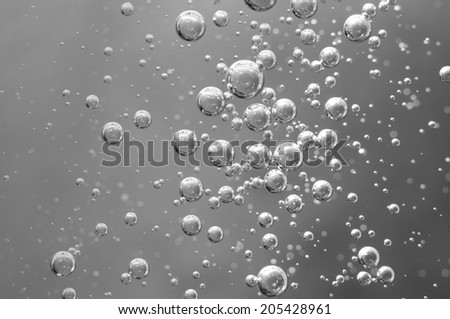 Air bubbles in a liquid. Abstract black-and-white background. rather unique macro photo, for your  successful business design.  Macro