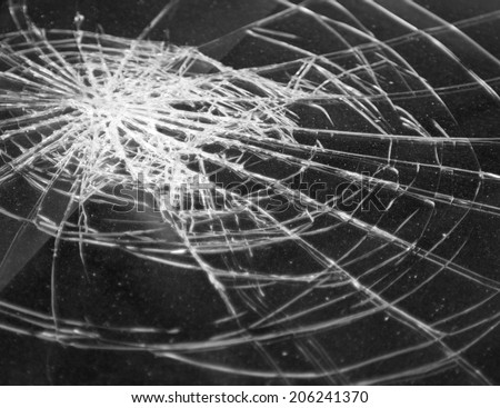 Broken glass in car. Abstract black-and-white background