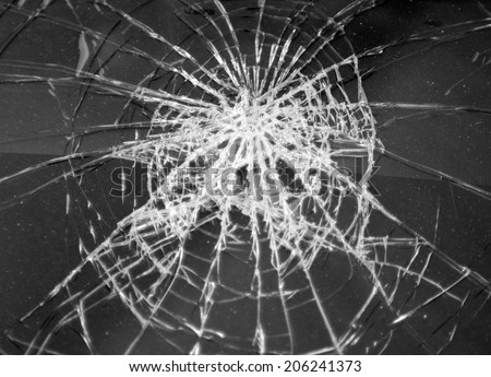 Broken glass in car. Abstract black-and-white background
