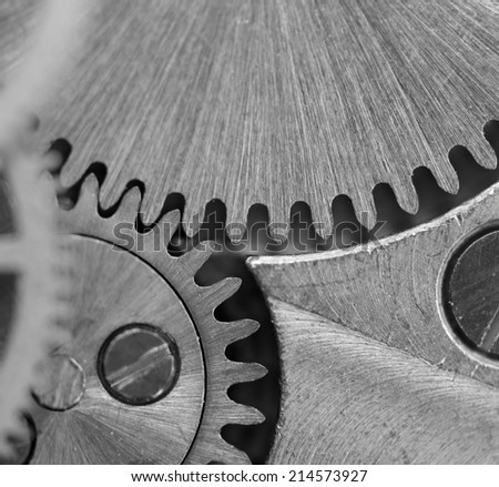 Black white background with metal cogwheels a clockwork.Rather unique macro photo, for your successful business design. Extreme closeup. Macro