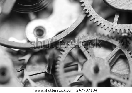 Black and white background with metal cogwheels inside clockwork. Conceptual photo for your successful business design. Macro.