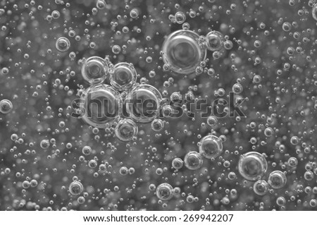 Macro Oxygen bubbles in water on black-and-white background, concept such as ecology and other your successful projects