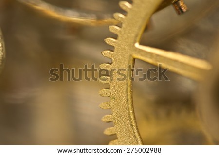 Background with metal gold cogwheels in old clockwork. Conceptual  photo for your successful business  workflow . Macro