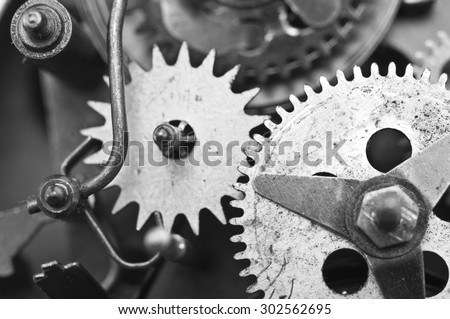 Black white Metal Cogwheels Inside Old Clockwork to success concept for your technology design. Macro
