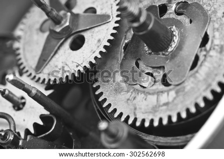Black white Metal Cogwheels Inside Old Clockwork to success concept for your technology design. Macro