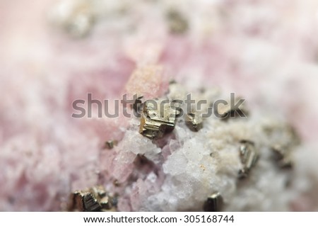 Rhodochrosite is a manganese carbonate mineral with chemical composition MnCO3 with iron pyrite FeS2 Macro