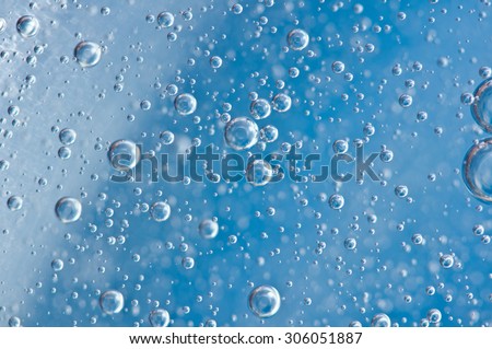 Macro Oxygen bubbles in blue clear water, concept such as ecology, environment, clean sea, potable water