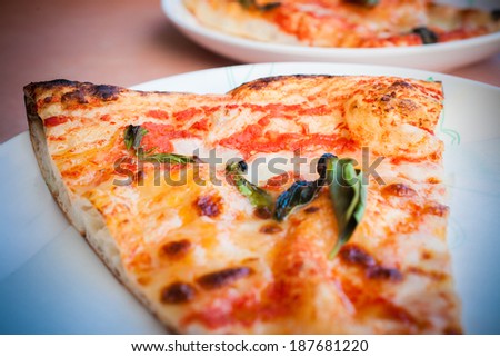 Traditional slise of pizza margarita