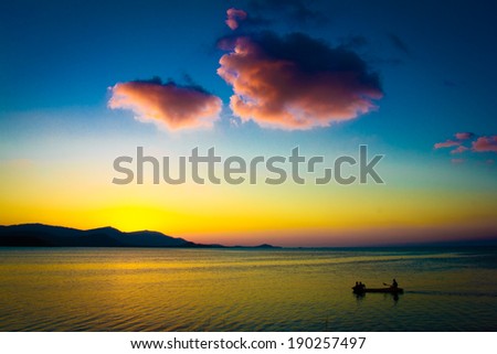 Fishing Boat with fisherman at magic Sunset on Koh Samui