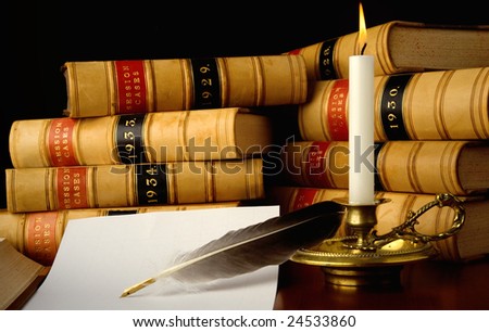Law reports, quill pen and candle.