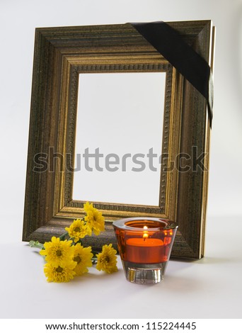 thick gold frame funeral, flowers, candles singer