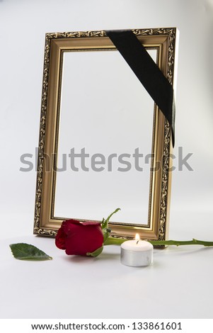 gold frame with sympathy rose