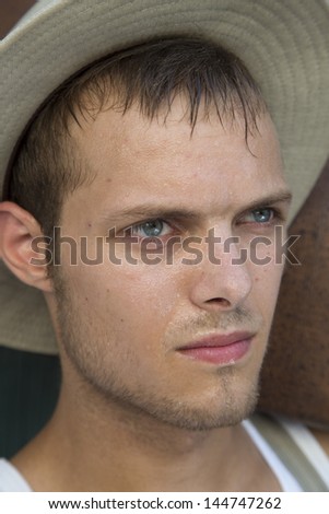 attractive sweaty man wit hat