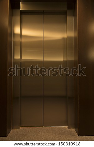 contemporary elevator interior with metal doors