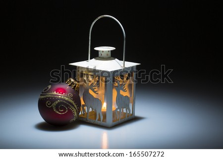 christmas candle lamp on white in front of dark background