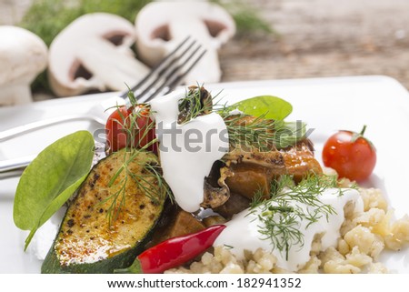 grill meat with noodles, sour cream and fresh vegetables for menu