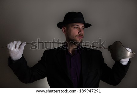 Handsome man with sword fencing and white gloves