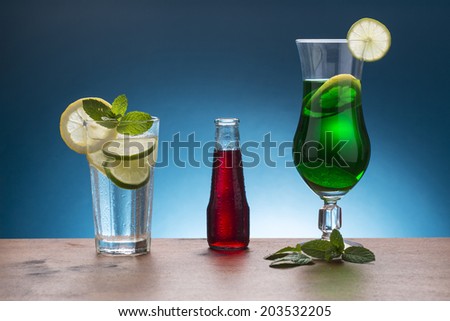 cold soda with lemon and mint, red italian aperitif, and mint lemonade