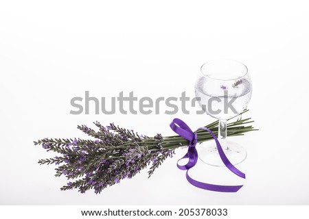 cooling lavender water with bouquet on white